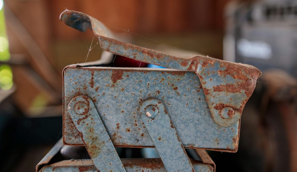 a rusted metal object sitting on top of a table